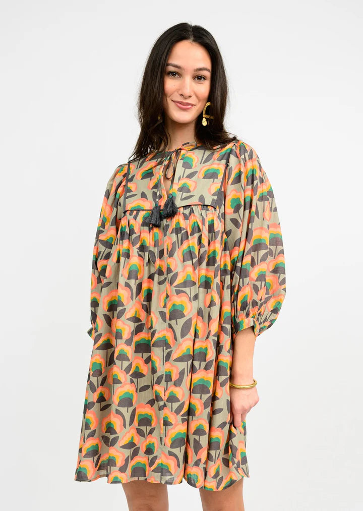 taupe patterned dress with tassels