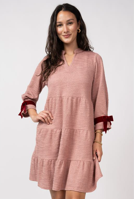 rose color dress with burgundy bows