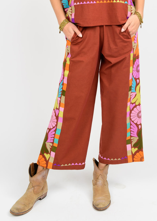 rust color pant with embroidery on sides 

