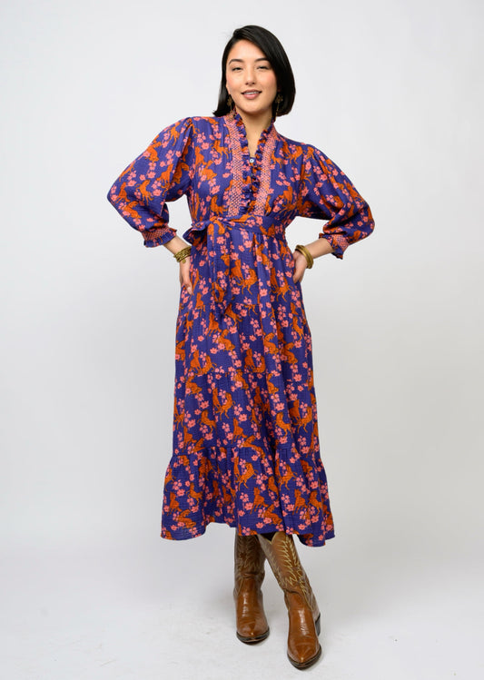 blue dress with pink floral and orange horses 
