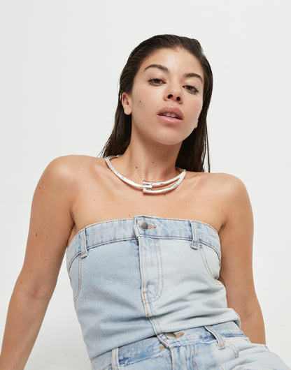 denim jumpsuit and silver collar necklace 