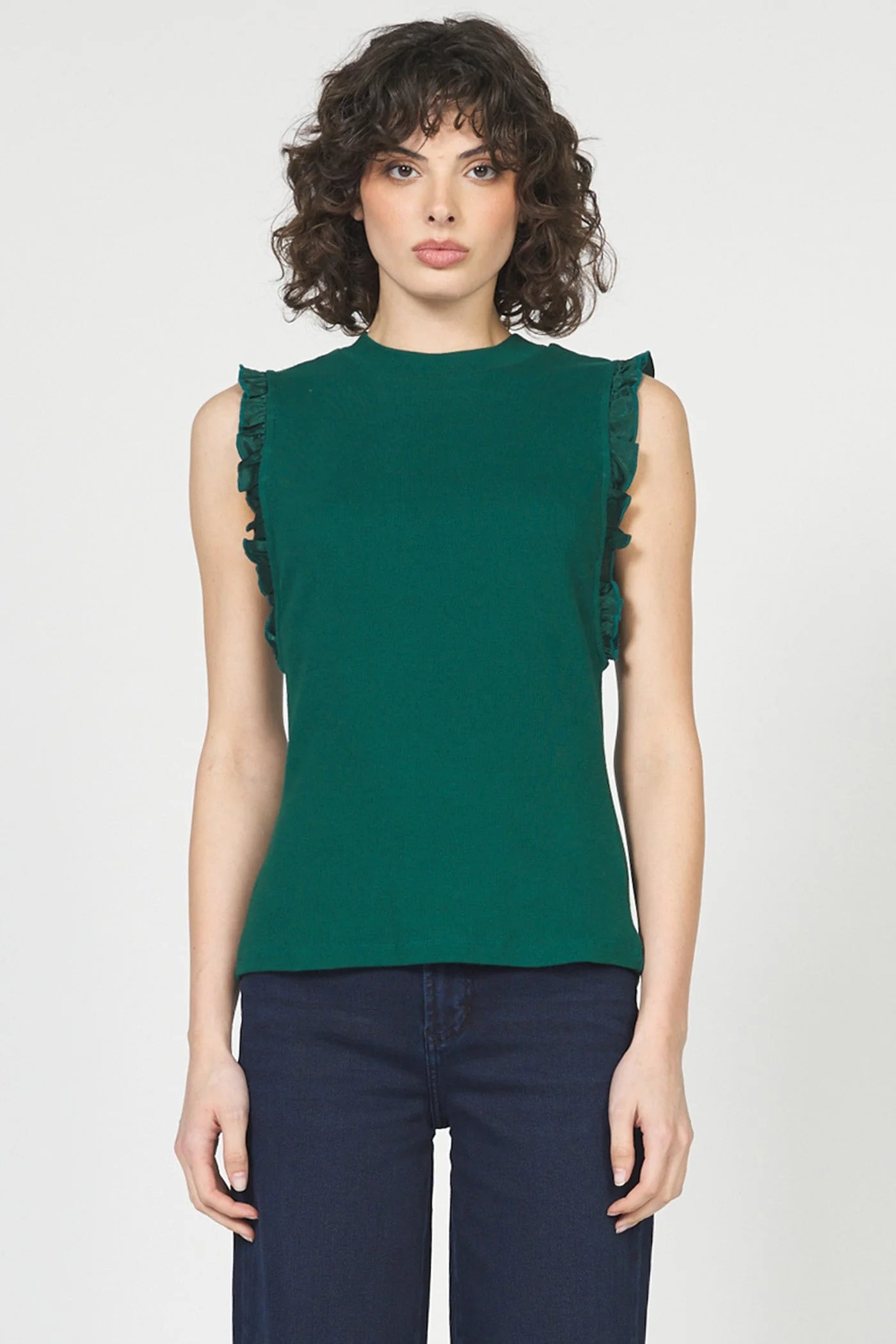 green sleeveless top with ruffles