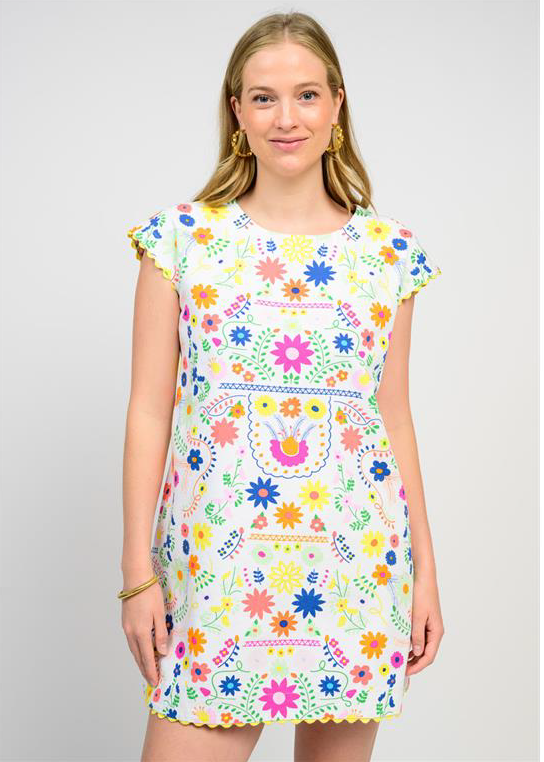 white dress with bright floral pattern 