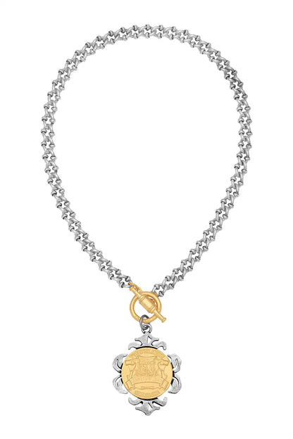 silver necklace with gold medallion 