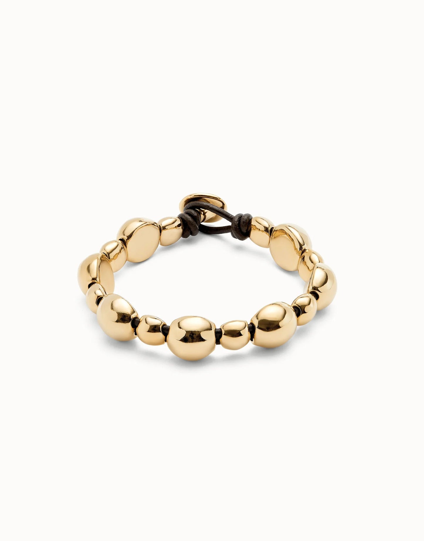 gold beaded bracelet with leather clasp
