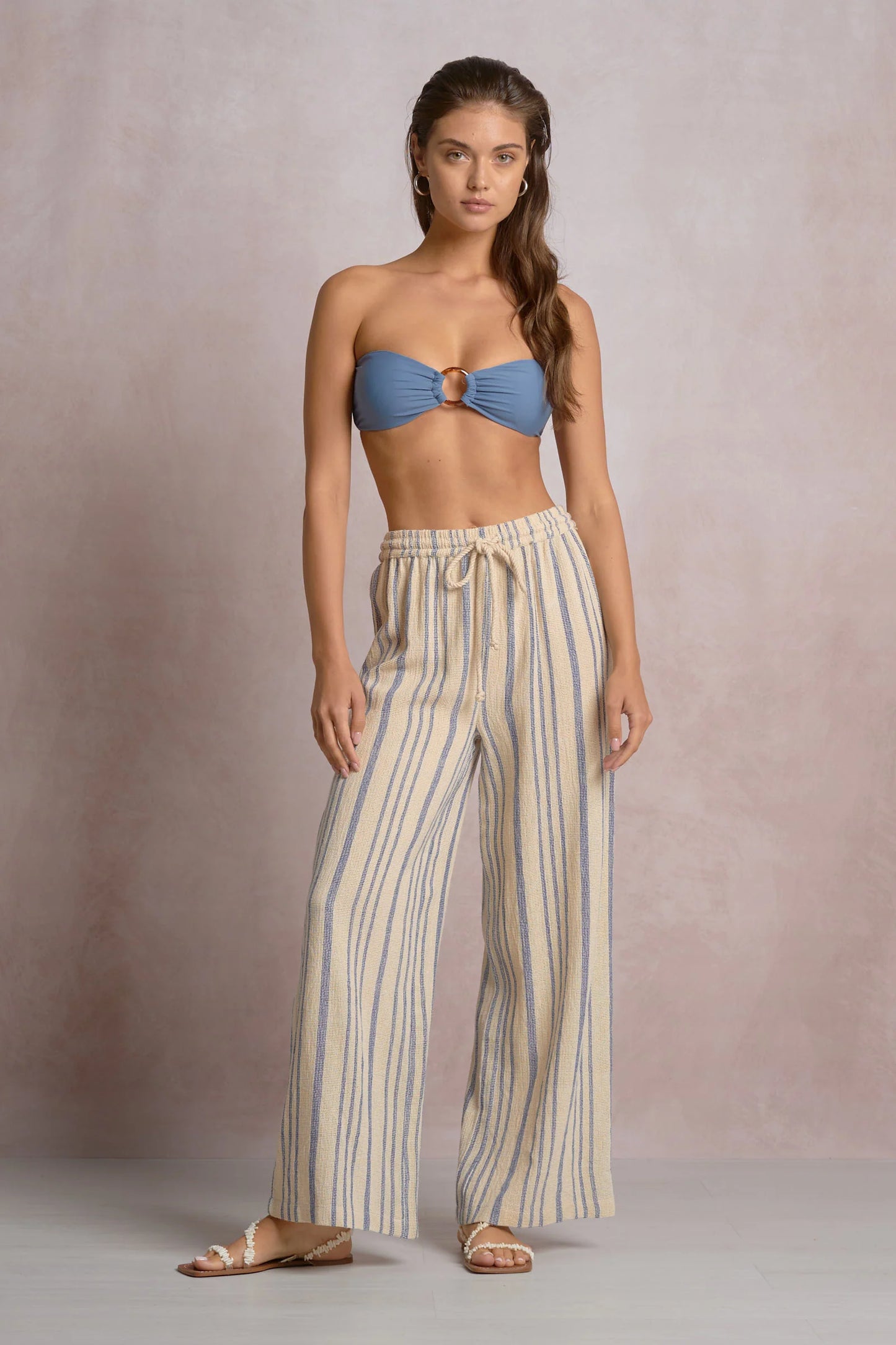 beige drawstring pants with blue stripe 
