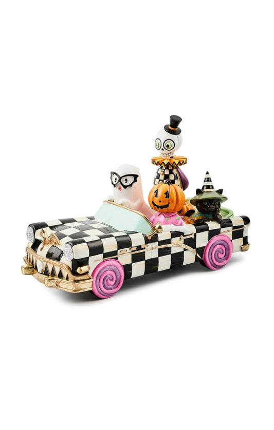 black and white 
car with ghost skeleton and pumpkin 